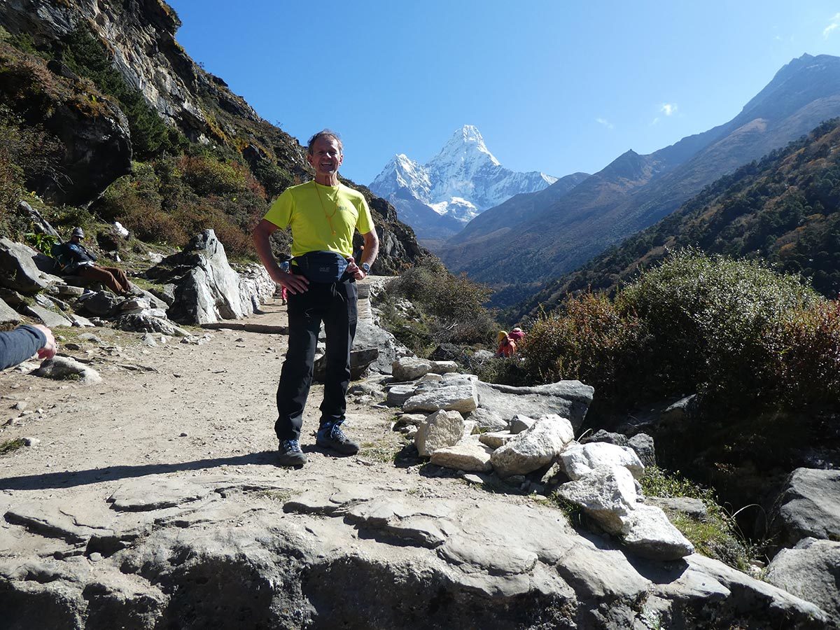 man in yellow tshirt climbing everest