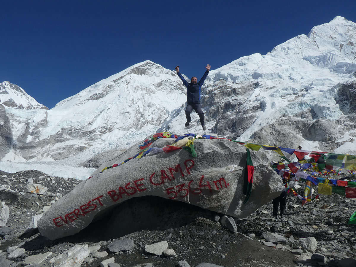 man jumping at everest base camp